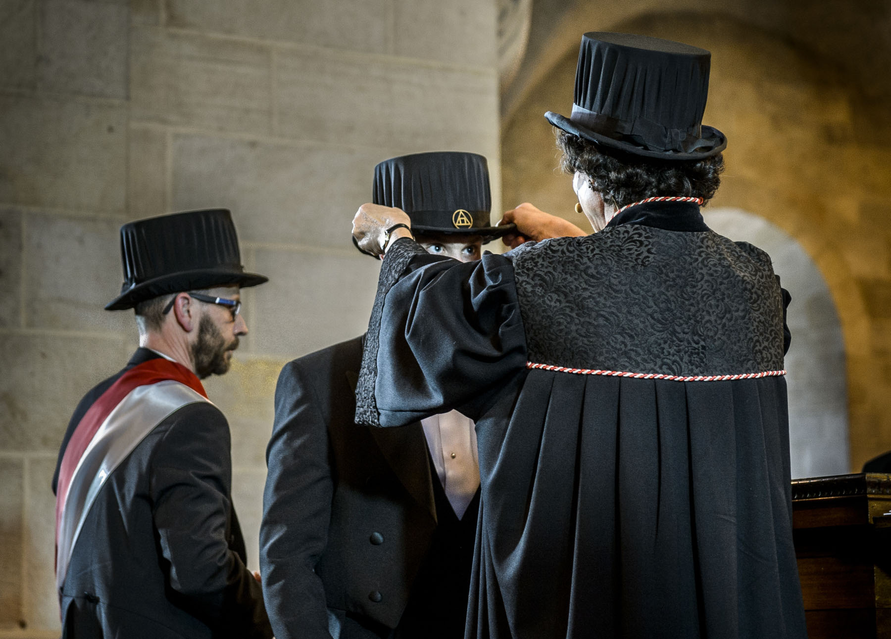 Three persons at the Doctoral degree conferment ceremony